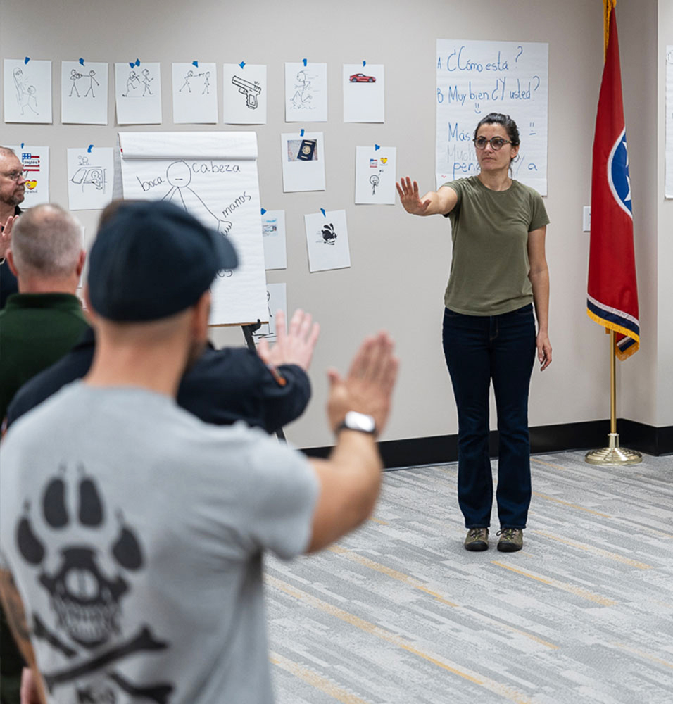 A Tennessee Language Center employee teaches Spanish to law enforcement officers.